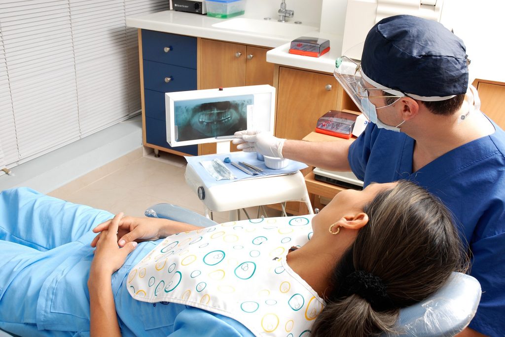 Emergency dentist in Lilydale showing a dental x-ray to a patient